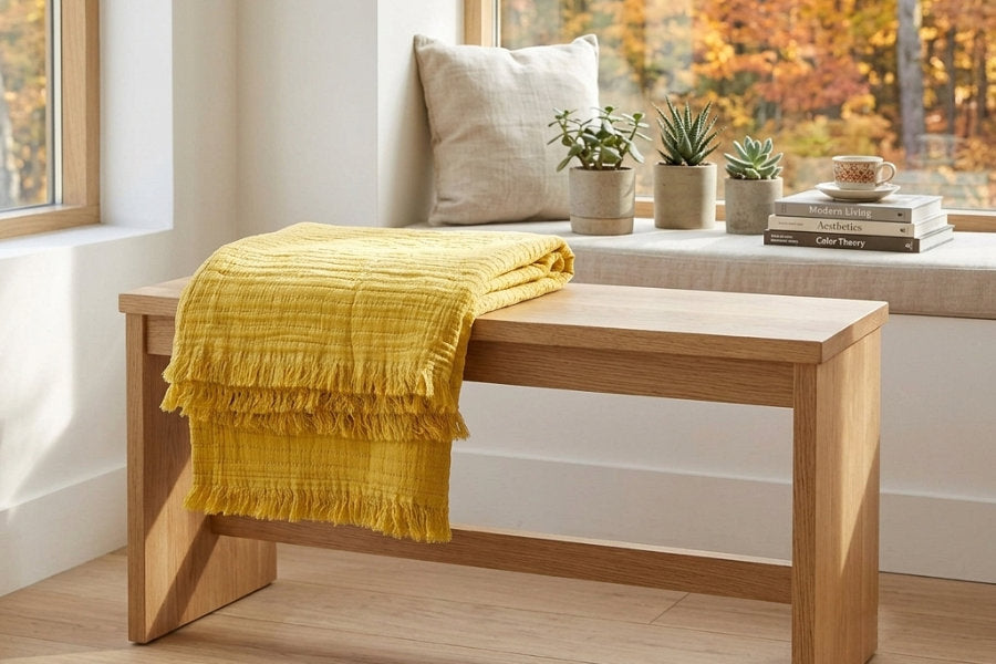 living room setting with yellow seersucker throw and outdoor view from Hem And Tassel 