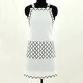 mannequin wearing plain white apron with black and white 'steam' print design on pocket and hems - from Hem And Tassel