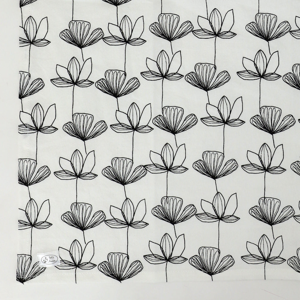 Pattern of black floral outlines on a light gray background