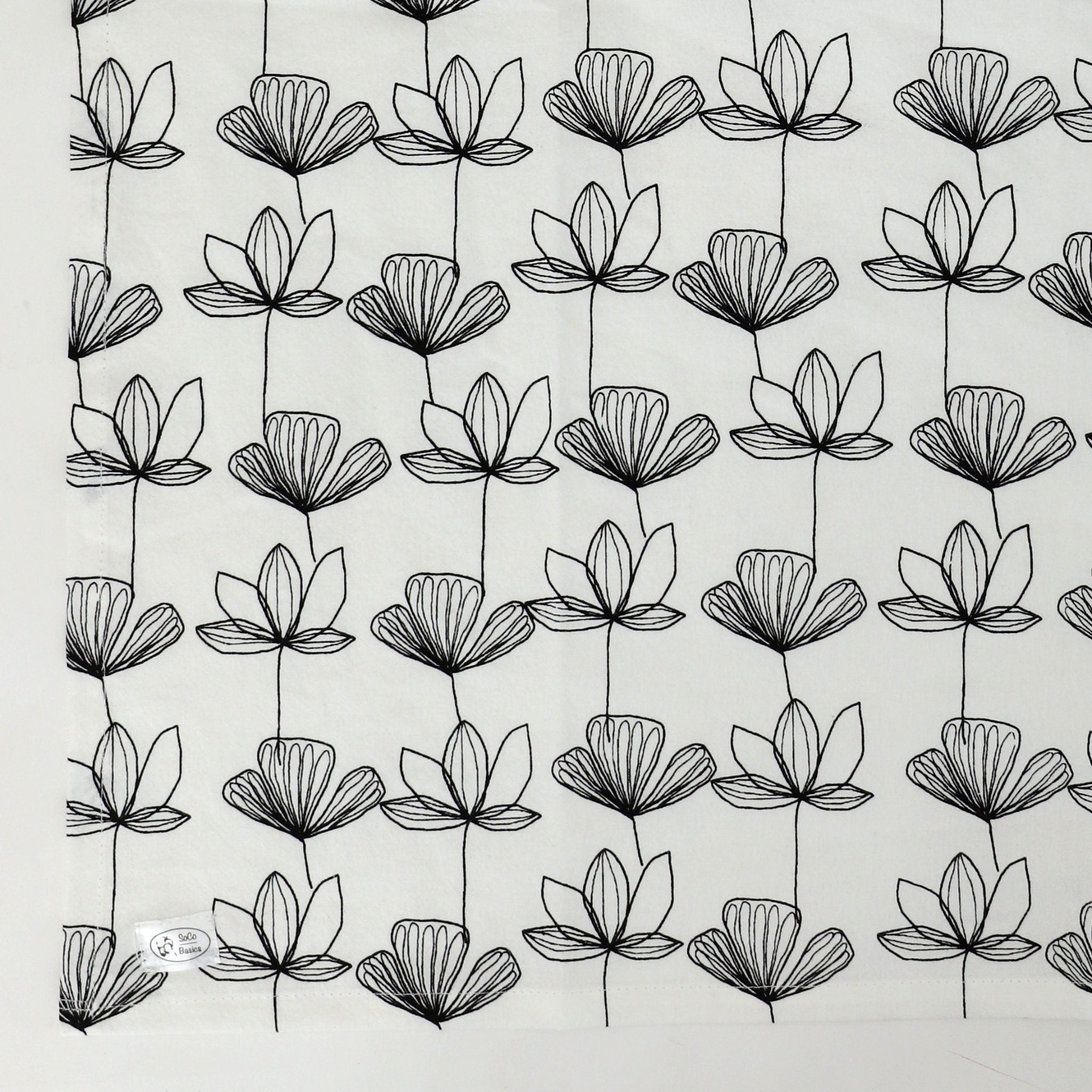 Pattern of black floral outlines on a light gray background
