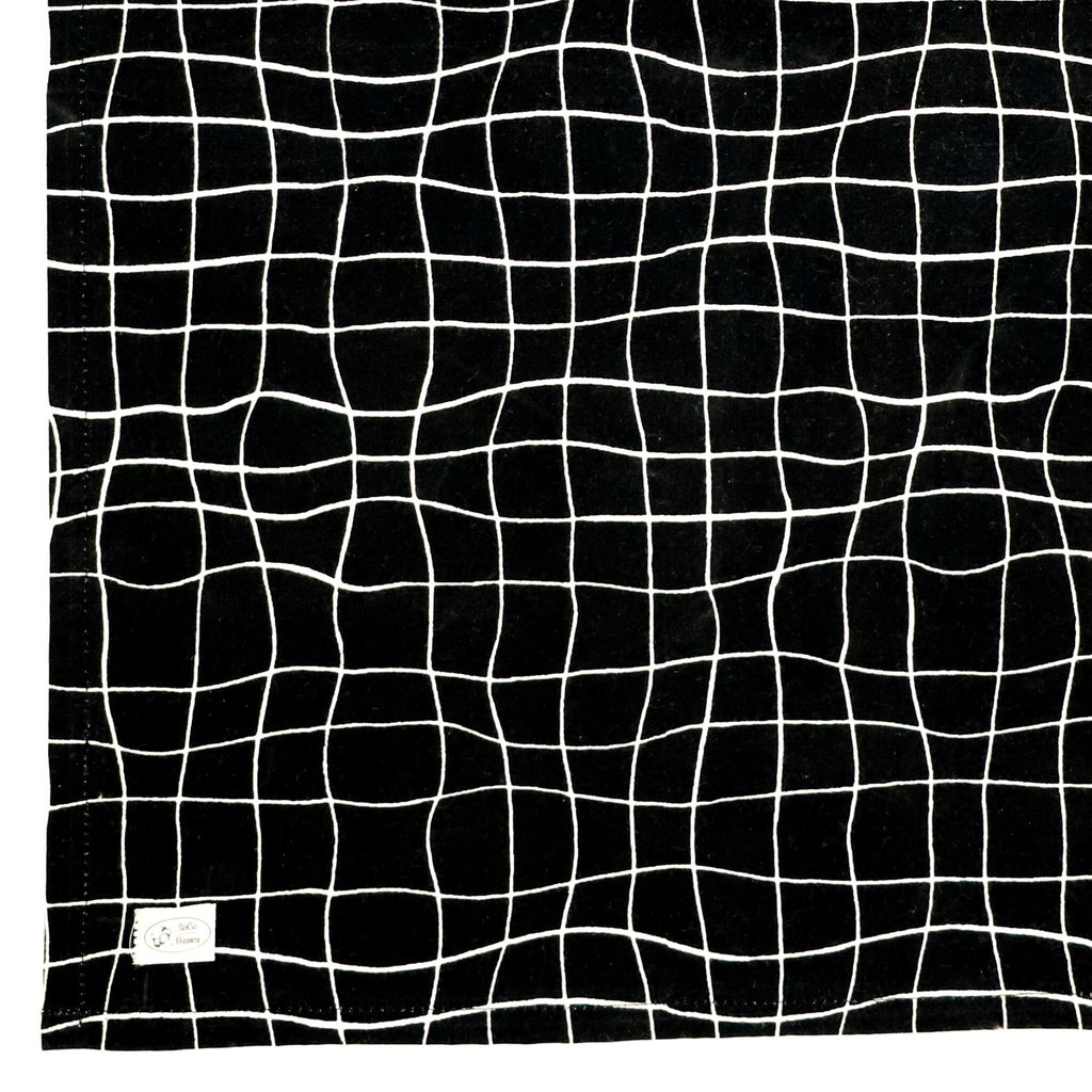 B&W string Apron and towel pattern close up with white wavy lines on black background