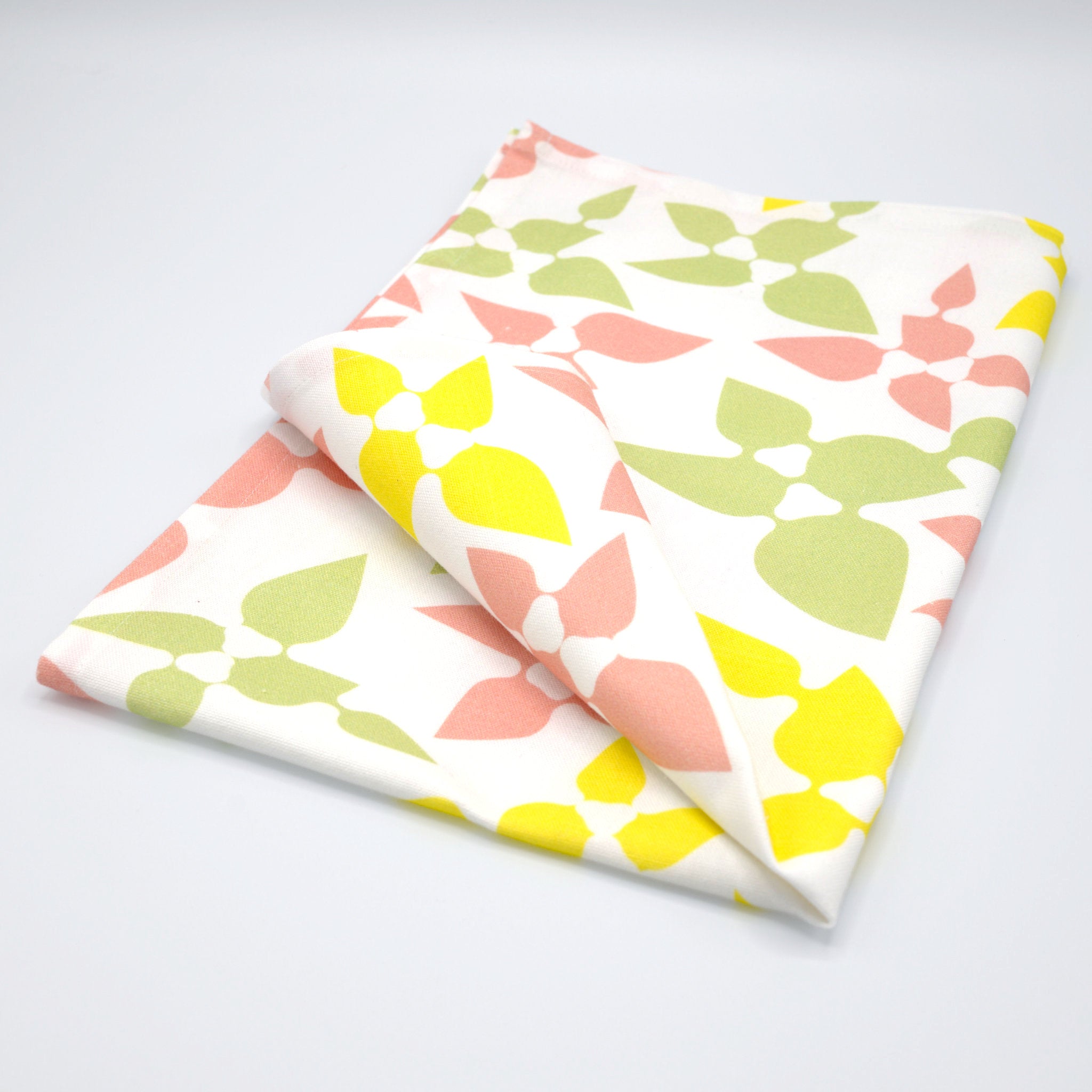 rich cotton percale kitchen towel of 'celebration' design in mint, on light grey backdrop - from Hem And Tassel