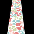Flock and flutter table runner with colorful birds pattern on a white background from Hem And Tassel 