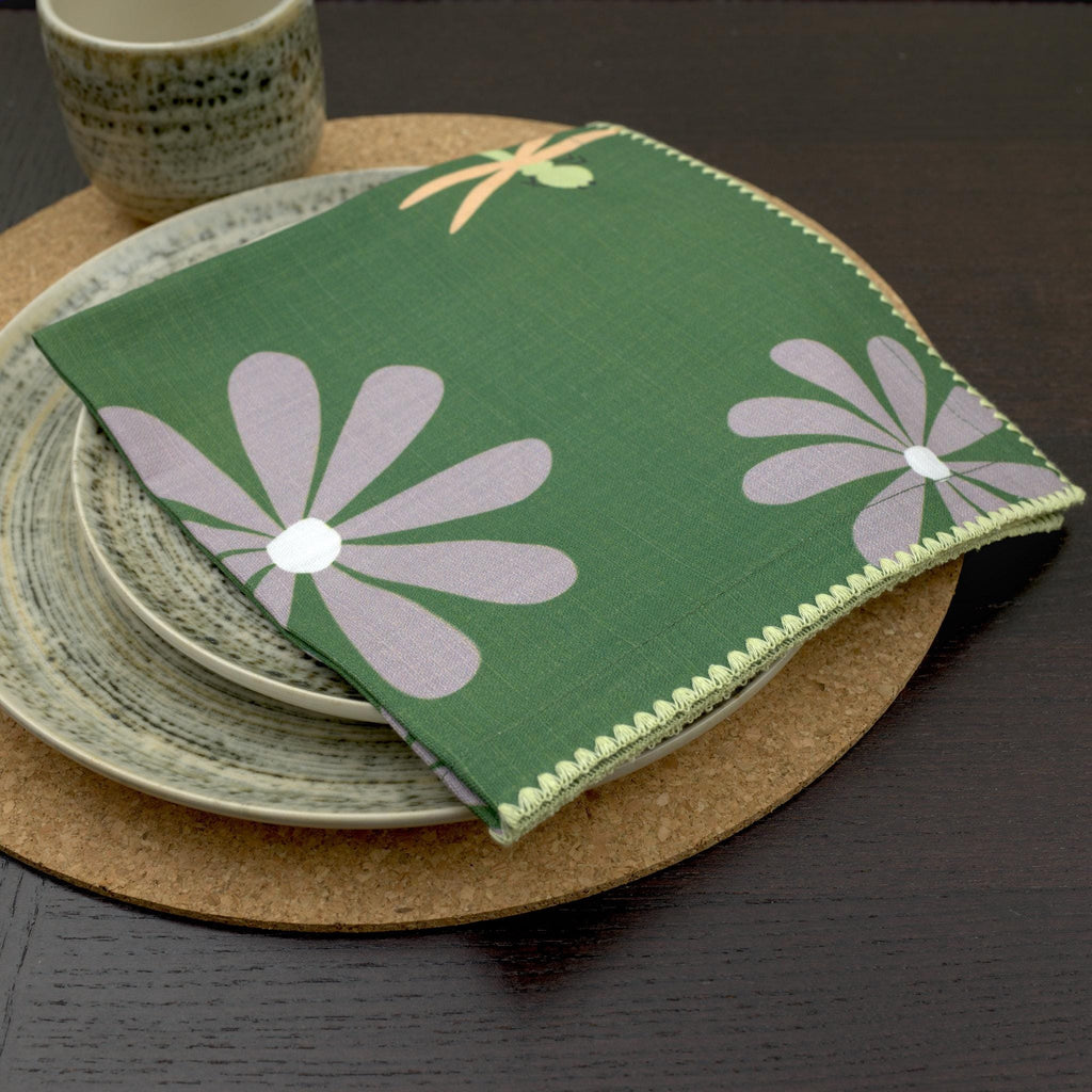 slub-cotton dinner napkin of shy dragonfly design in green in dining place setting- from Hem And Tassel