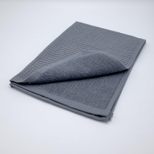 Jekyll and Hyde reversible kitchen or bath towel in dark grey on a light grey background- from Hem And Tassel