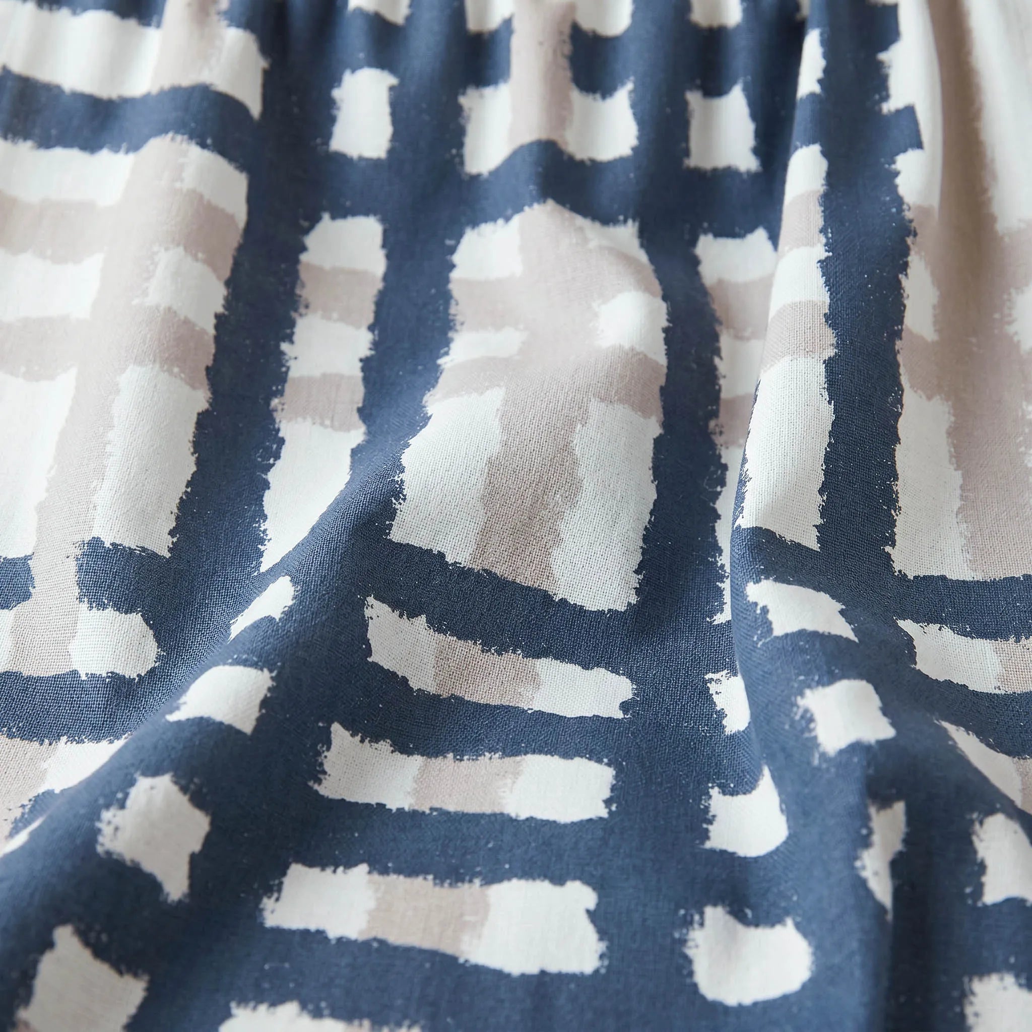 Close-up of cotton kitchen towel with oil and slate abstract pattern from Hem And Tassel 