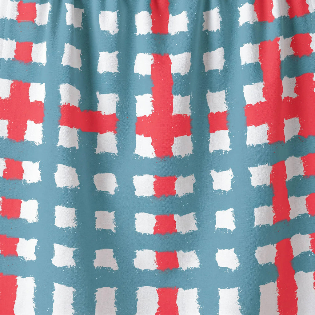 Pattern of red and white crosses on a blue cotton kitchen towel from Hem And Tassel 