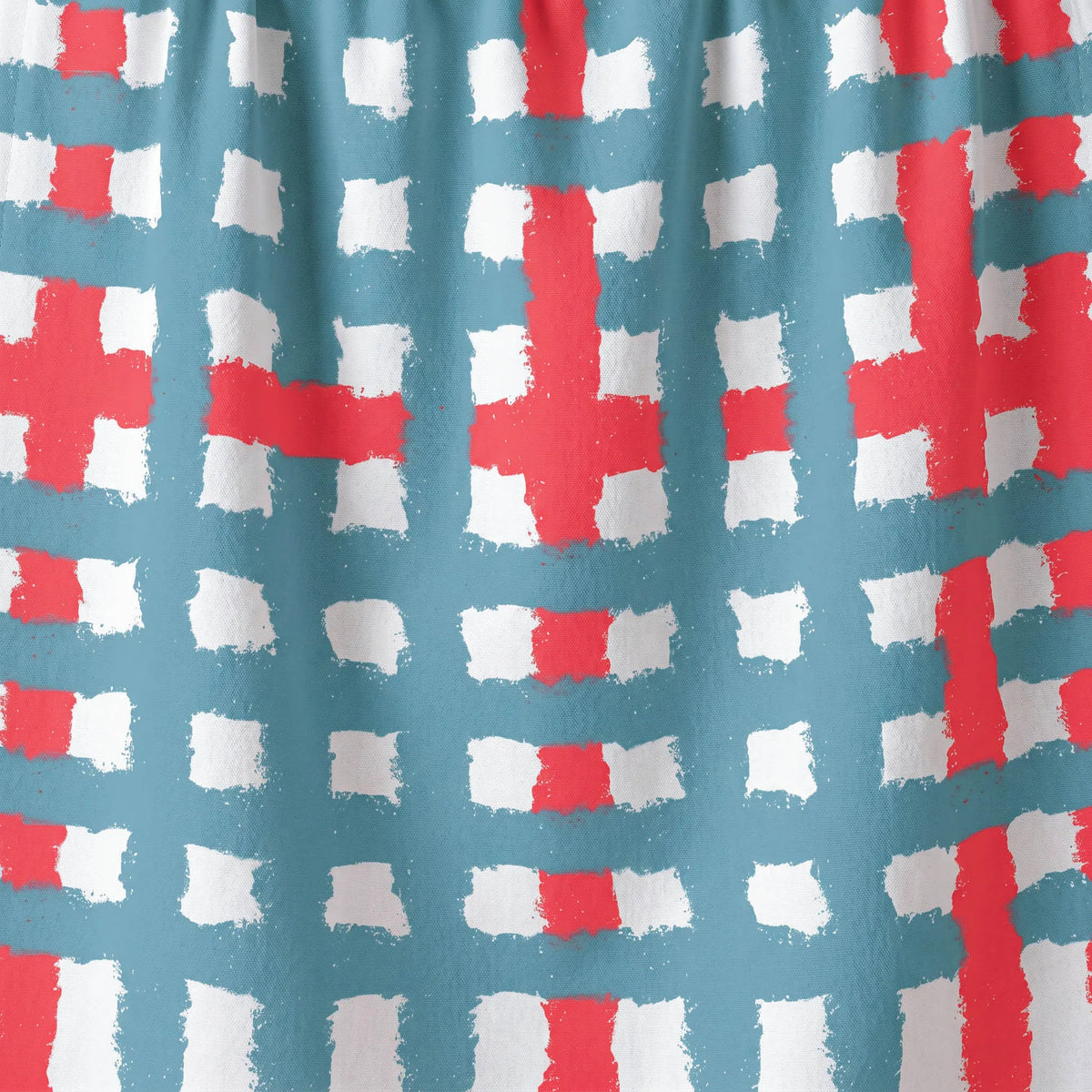 Pattern of red and white crosses on a blue cotton kitchen towel from Hem And Tassel 