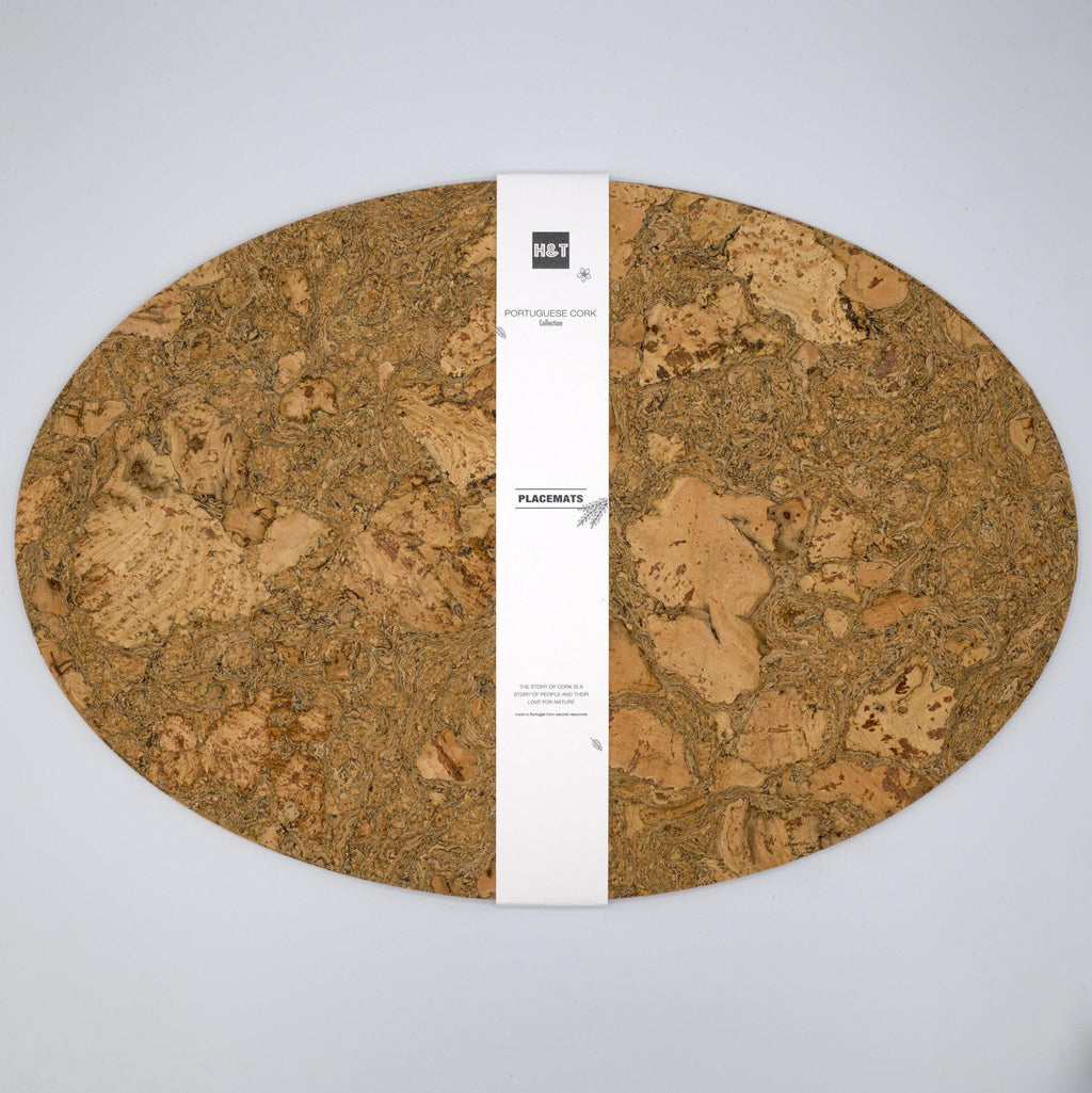 Large oval cork placemat set of two in a bandroll with a visible brand label of Hem And Tassel on a light gray background