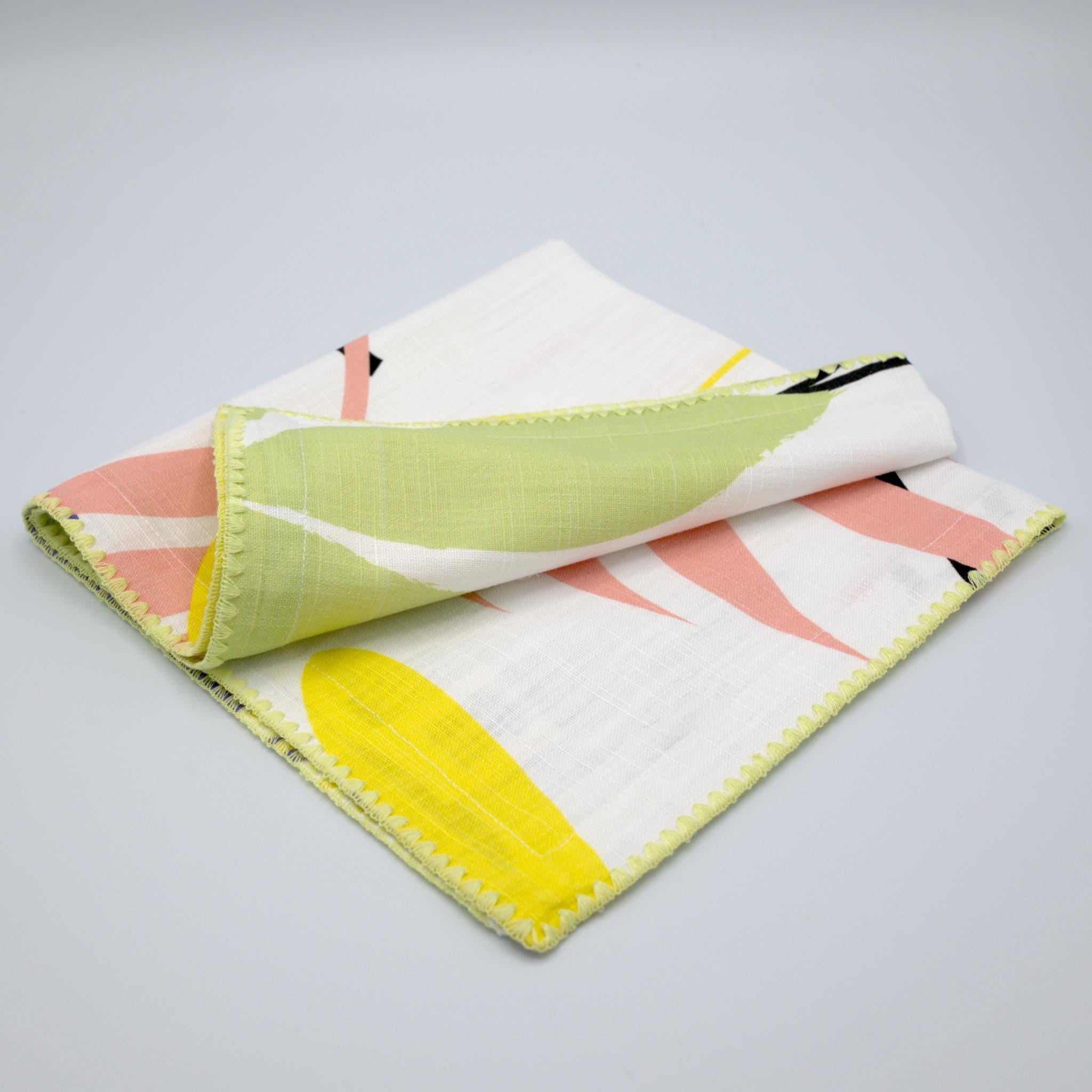 pollen up design slub cotton dinner napkin in Spring colors against light grey background - from Hem And Tassel