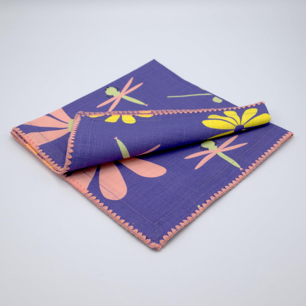 Purple and blush 'Shy Dragonfly" design cotton napkins by Hem And Tassel on a light grey background