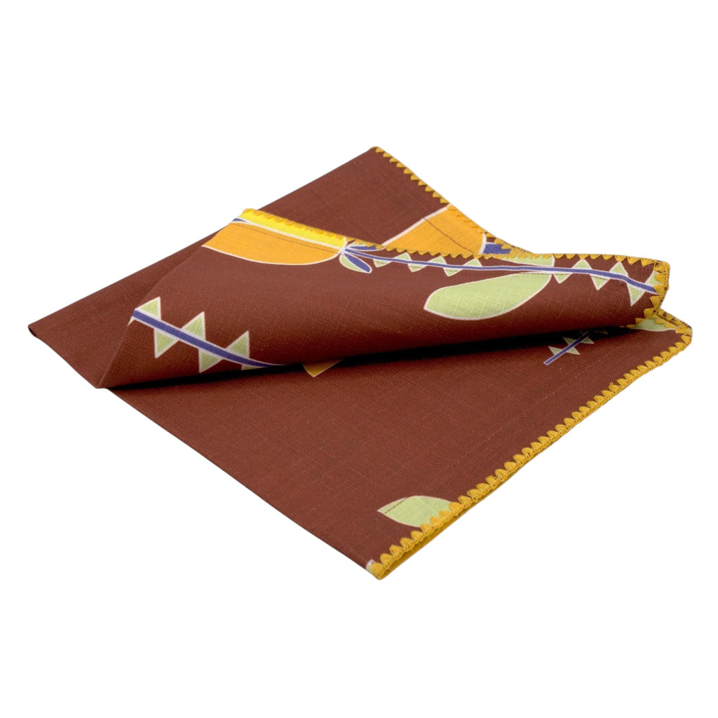 slub-cotton dinner napkin of Lip Tulip design in clay, against light grey backdrop- from Hem And Tassel