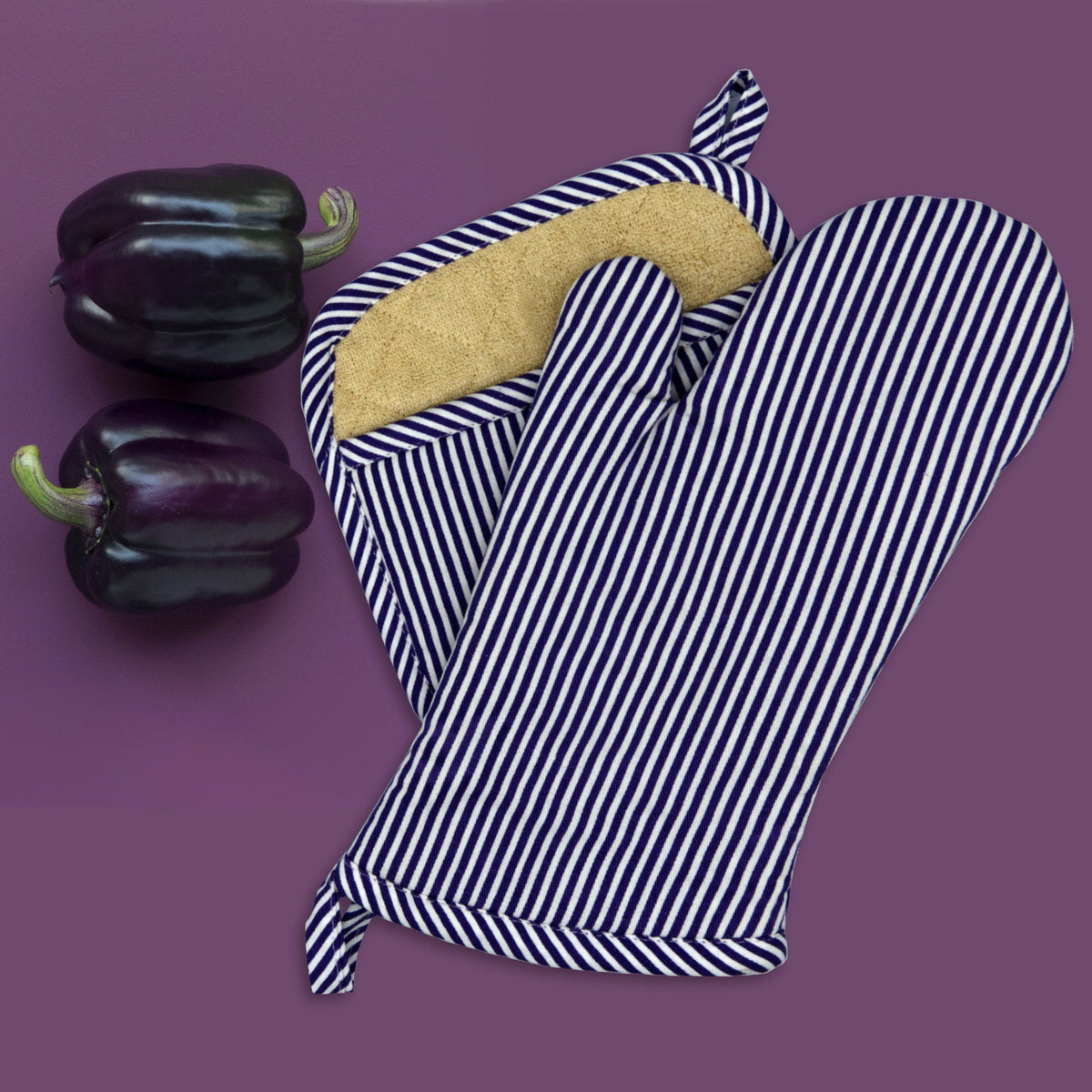 banker stripes deign oven mitt and pot holder in plum, with aubergine on a purple background - from Hem And Tassel