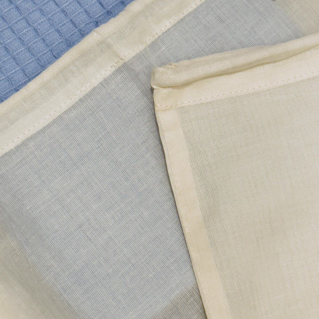 Close-up of Two organic cotton produce bags  on blue towel background from Hem And Tassel 