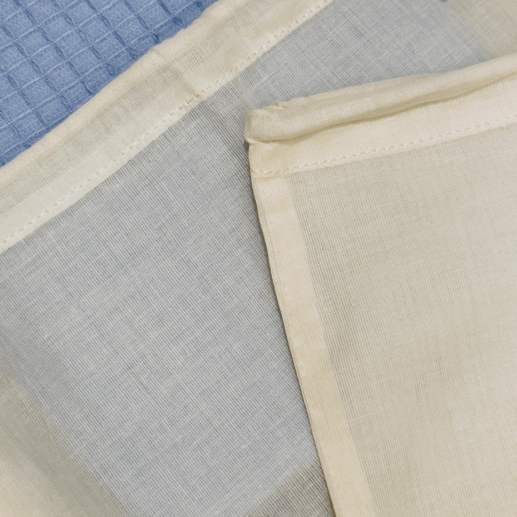 Close-up of Two organic cotton produce bags  on blue towel background from Hem And Tassel 