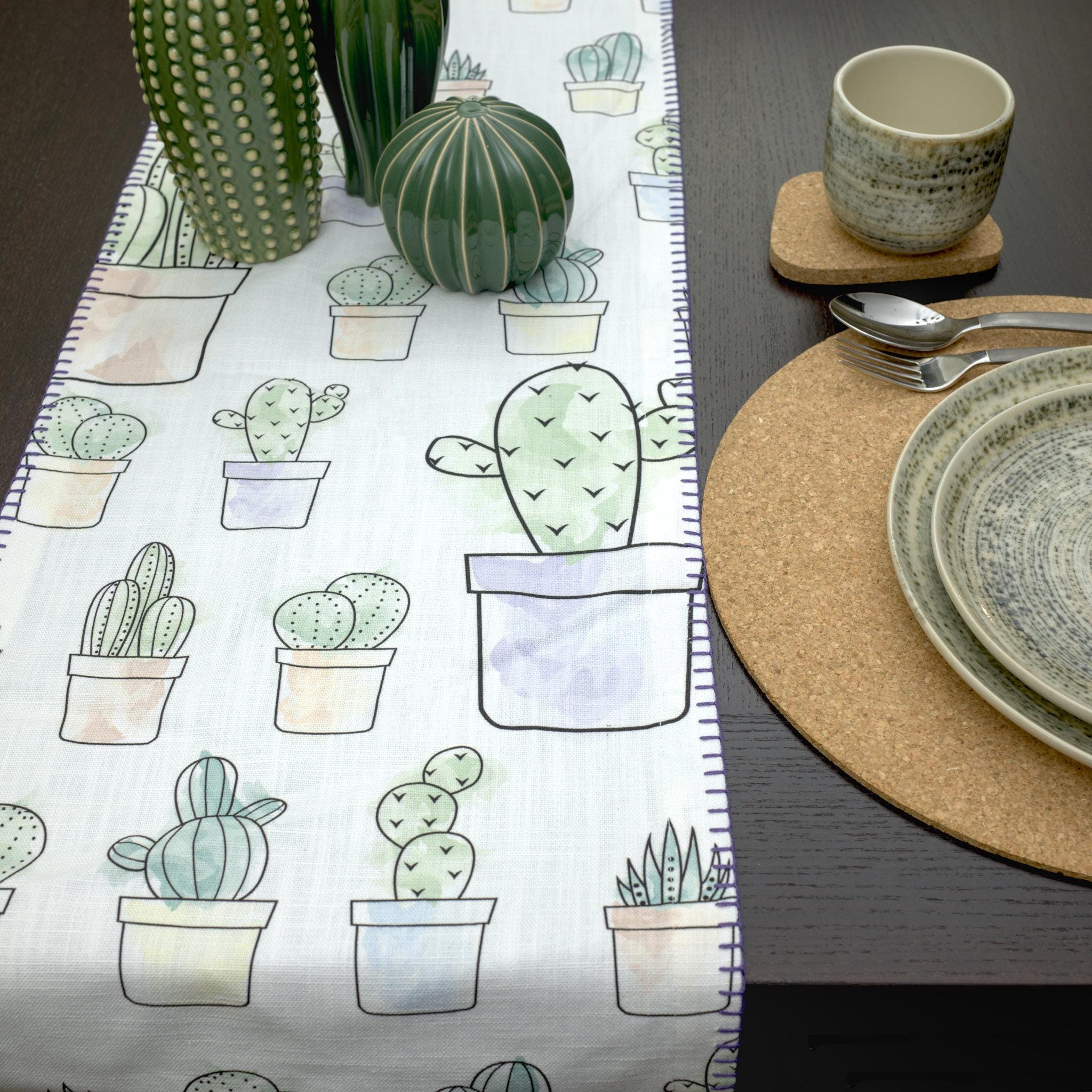 textured slub cotton table runner with decorative hems, in desert haze design, with a place setting on dark dining table - from Hem And Tassel