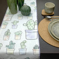textured slub cotton table runner with decorative hems, in desert haze design, with a place setting on dark dining table - from Hem And Tassel