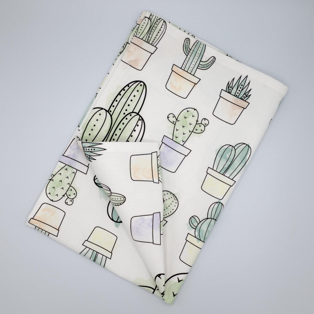 towel with cactus pattern on a gray background from Hem And Tassel 