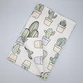 towel with cactus pattern on a gray background from Hem And Tassel 