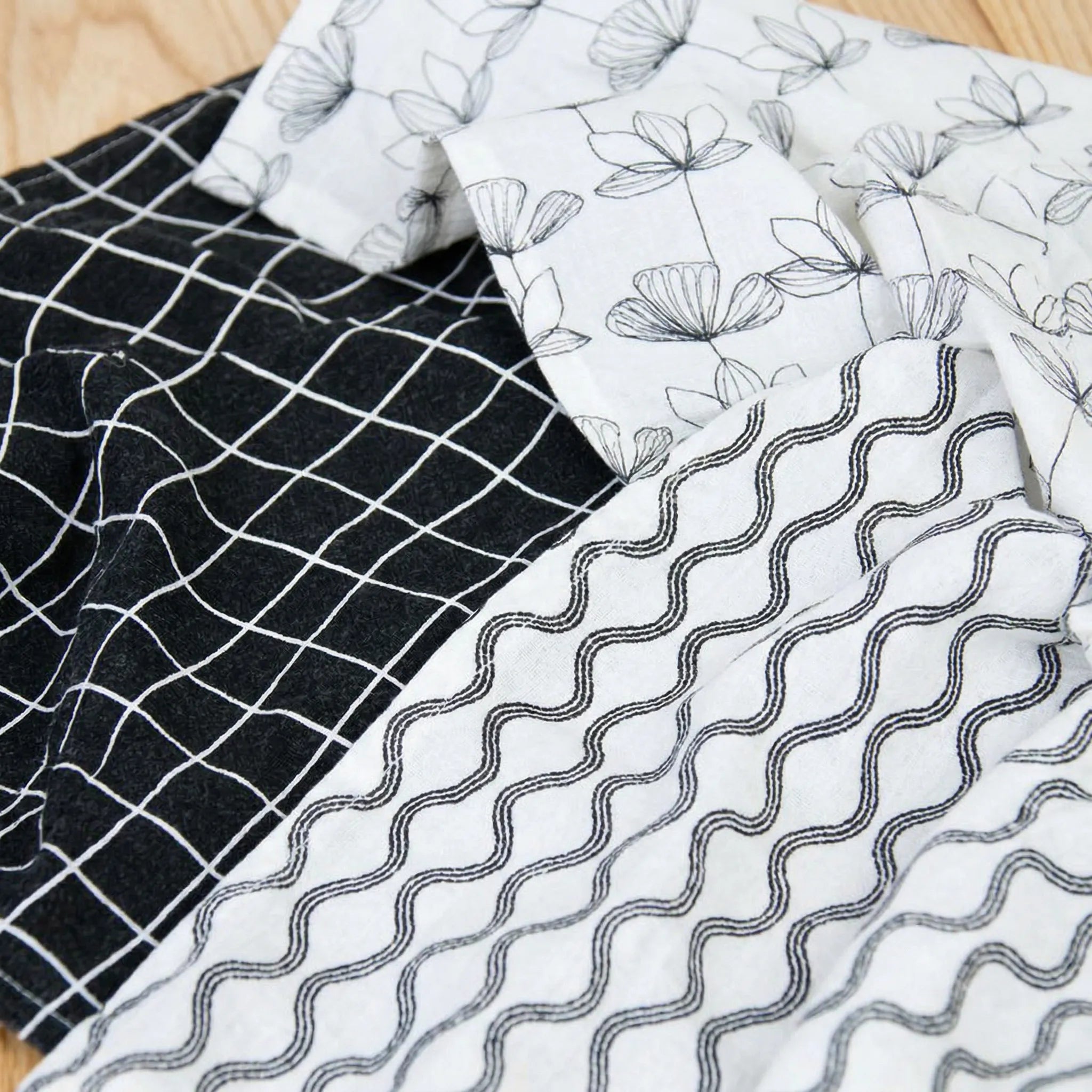 crinkled flour sack - set of three 100% cotton kitchen towels in black and white designer prints, close up from Hem And Tassel