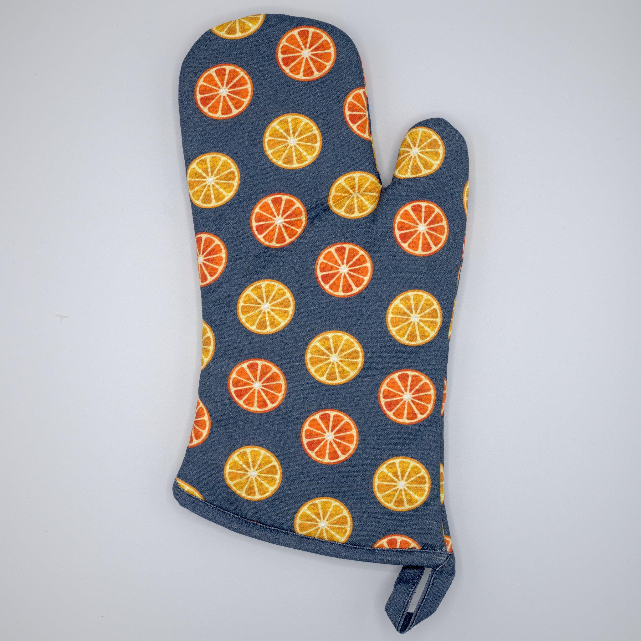 faded orange design, cotton pot holder with hanging loop from Hem And Tassel on a light grey background