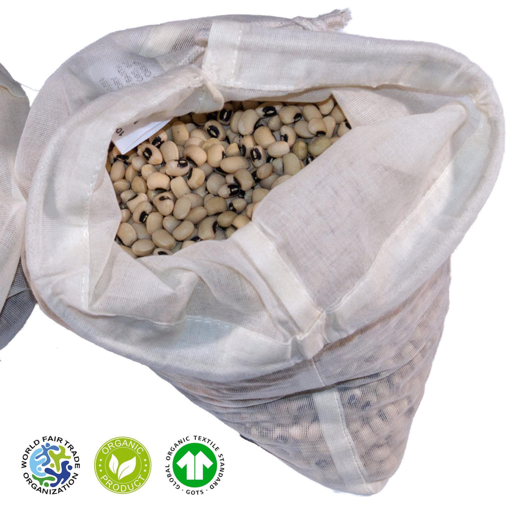 open organic cotton produce bag filled with beans on a white background, featuring Fair Trade and Organic certification logos