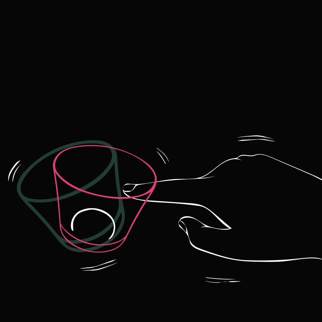 tottering whiskey glass graphic showing how it totters, made in Japan, from Hem And Tassel on a black background