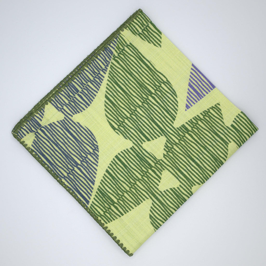 green and mint Pure cotton dinner napkin by Hem And Tassel in 'Celebration' design with leaf pattern against light grey background