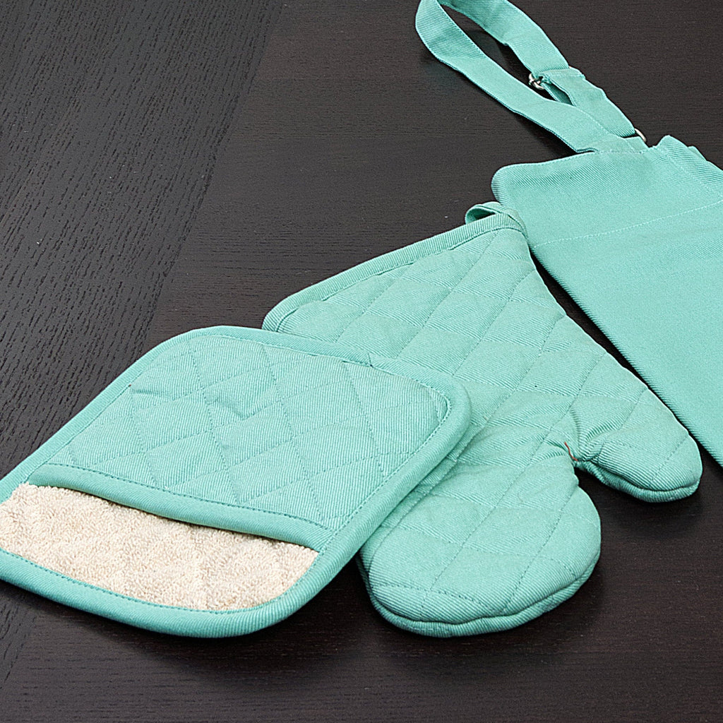 Set of turquoise oven mitts and pot holders on a dark surface