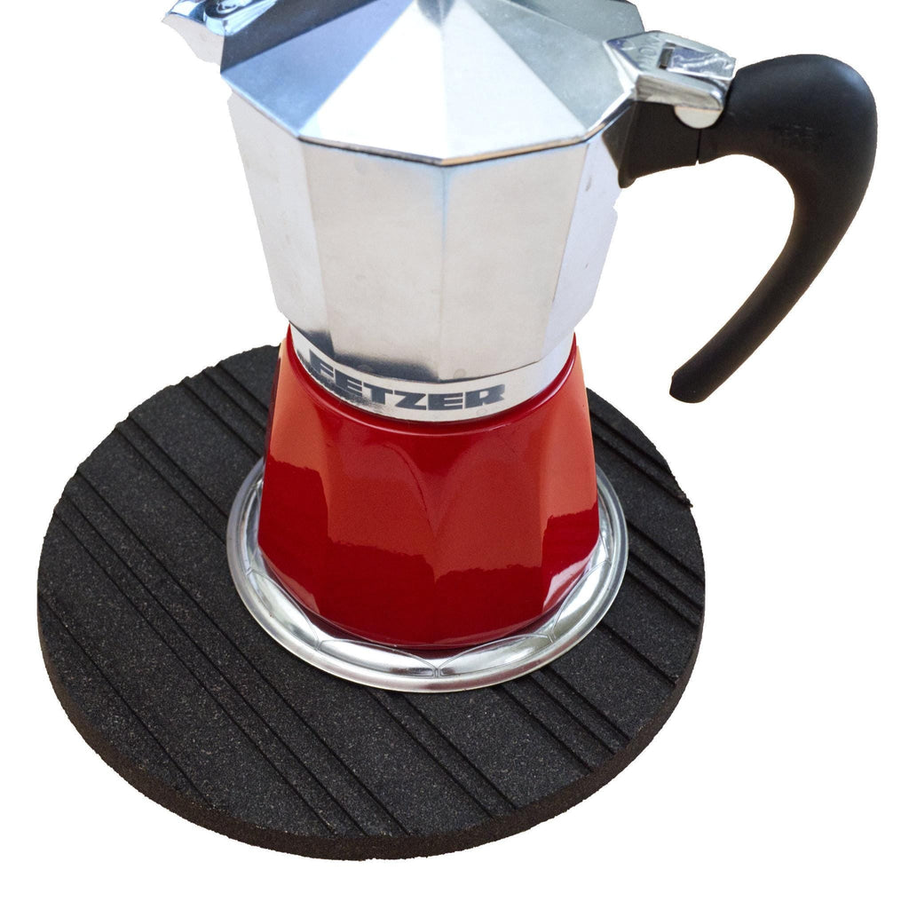 Red and silver Stovetop Espresso Maker on a black heatsink cork trivet from Hem And Tassel