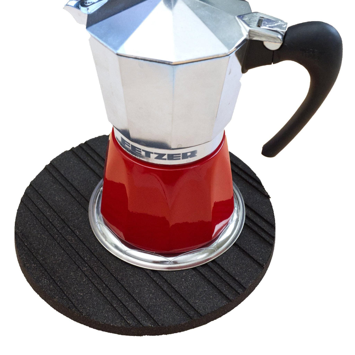 Red and silver Stovetop Espresso Maker on a black heatsink cork trivet from Hem And Tassel