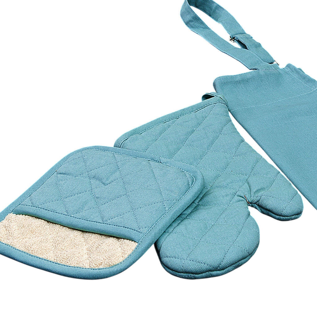 Hem And Tassel blue cotton drill oven mitt and pot holder set with quilted texture on a dark wooden surface