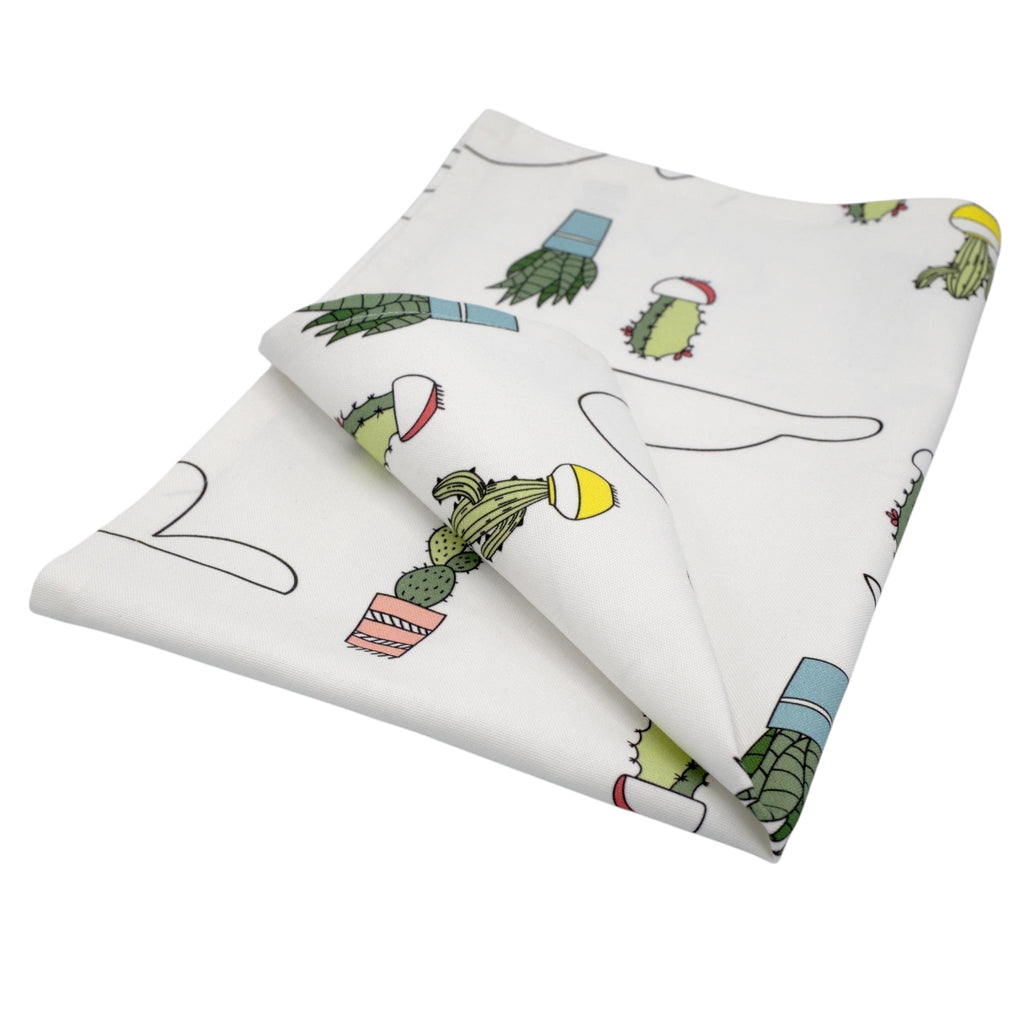 Hem And Tassel cotton kitchen towel featuring a minimalist white background with colorful potted cactus print