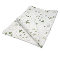 Hem And Tassel cotton kitchen towel featuring a green countryside print with trees, tents, and rivers on white fabric.
