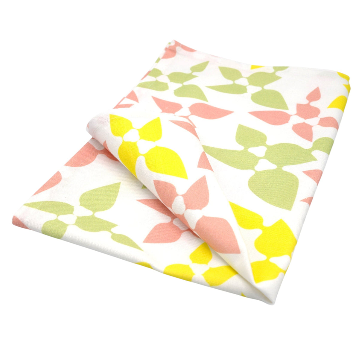 Hem And Tassel cotton kitchen towel with a vibrant confetti-inspired leaf pattern in yellow, pink, and green.