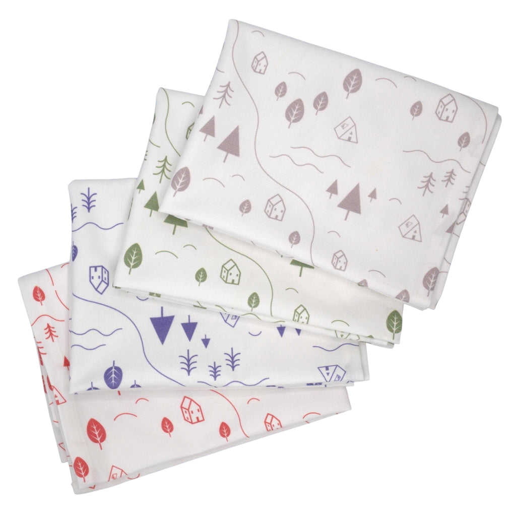 Hem And Tassel cotton kitchen towels featuring a countryside print with trees, rivers, and houses in assorted colors.