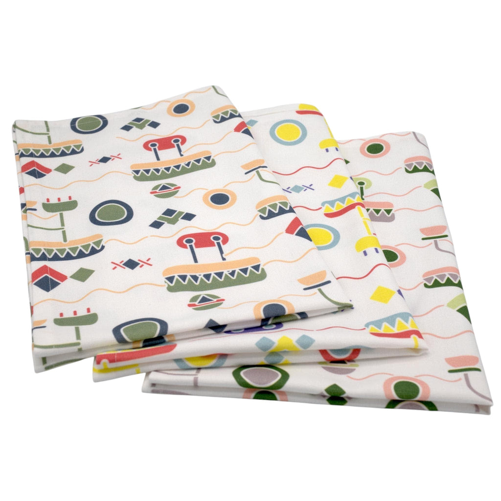 Hem And Tassel cotton percale kitchen towels featuring a playful, colorful digital-inspired geometric pattern.