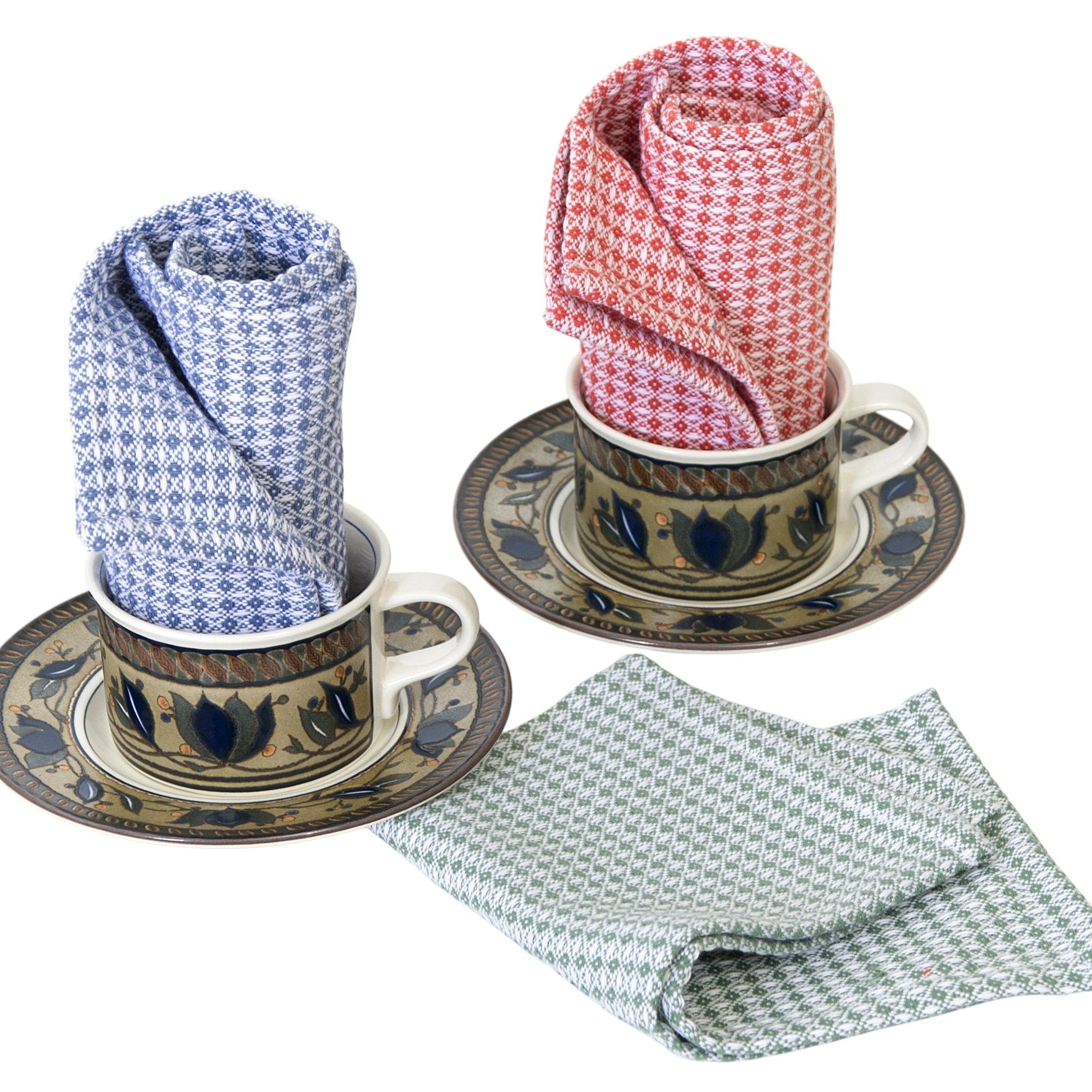 Hem And Tassel diamond waffle weave cotton cloths in blue, red, and green, displayed in decorative ceramic cups.