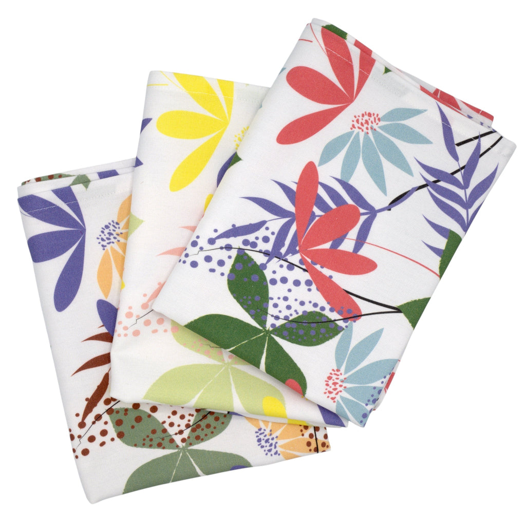 Hem And Tassel cotton kitchen towels featuring a colorful floral pollen print on a white background