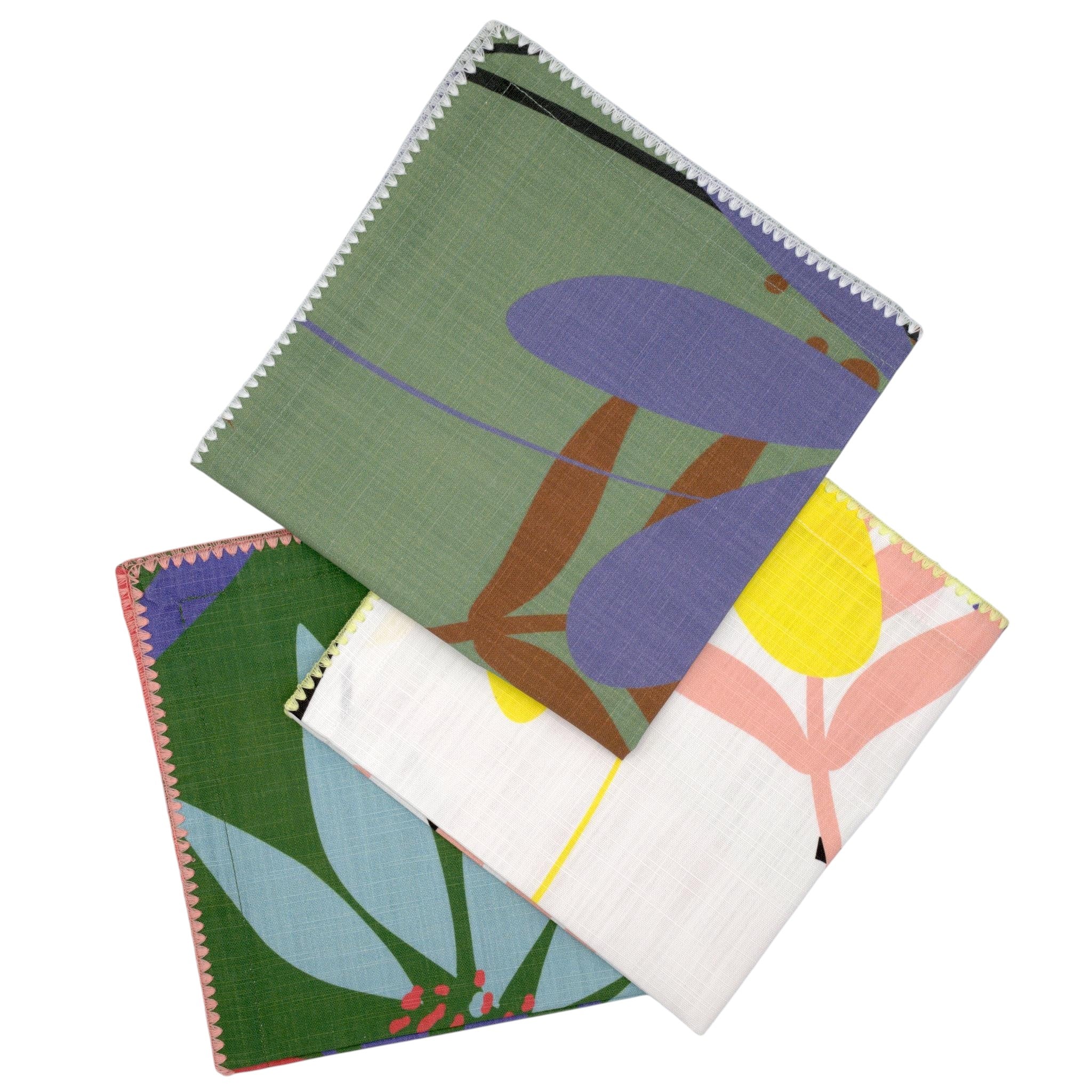 Hem And Tassel floral slub cotton dinner napkins with textured fabric and decorative stitched edges in green and white