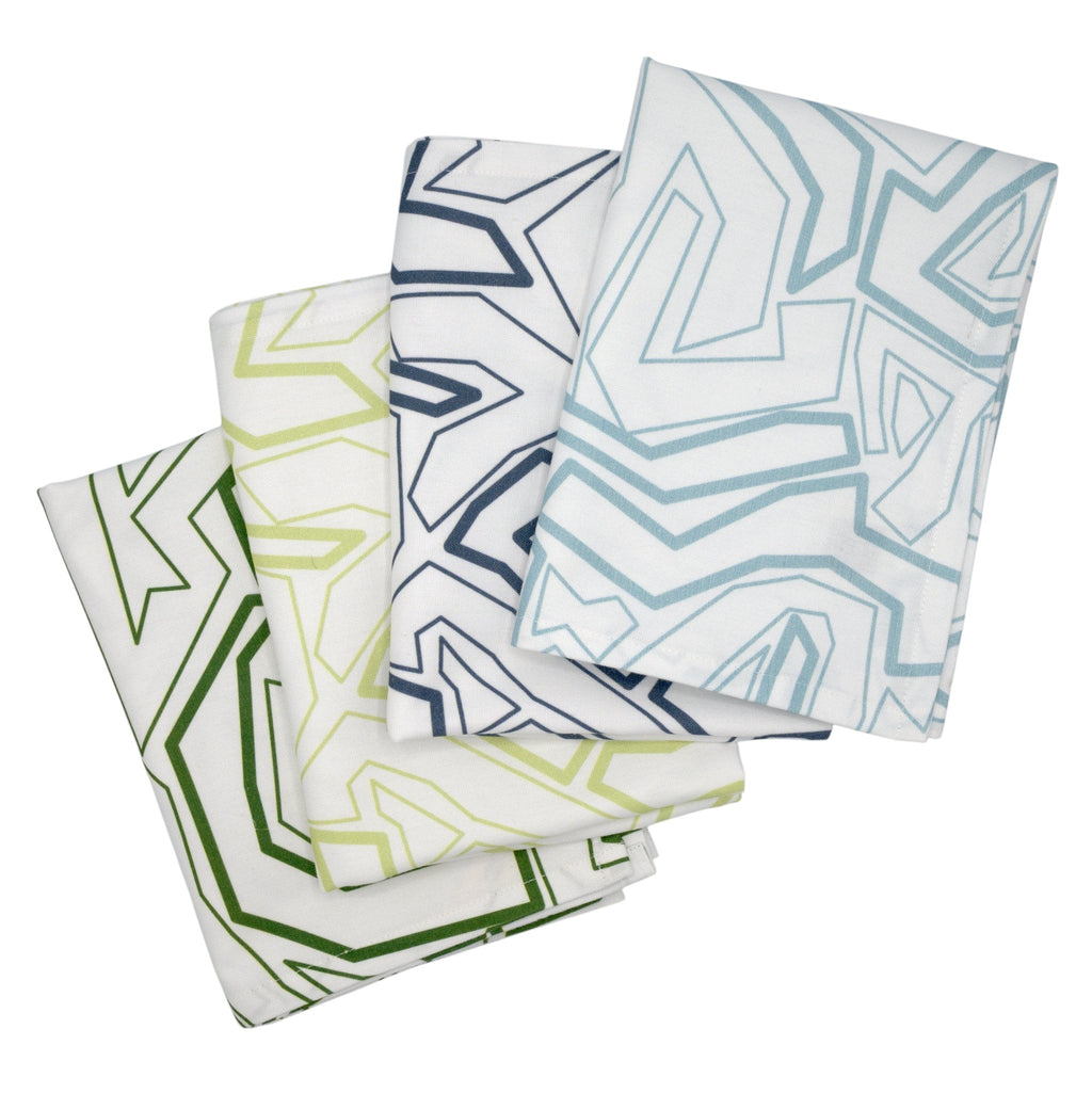 Hem And Tassel Squiggles cotton kitchen towels featuring modern geometric patterns in green, lime, navy, and blue.