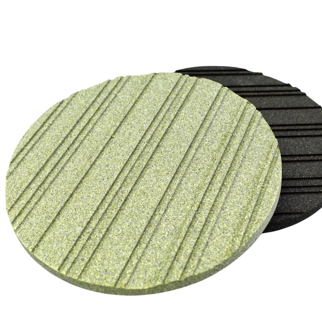 Hem And Tassel round cork trivets with grooved heat-dissipating patterns in green and black, made in Portugal.