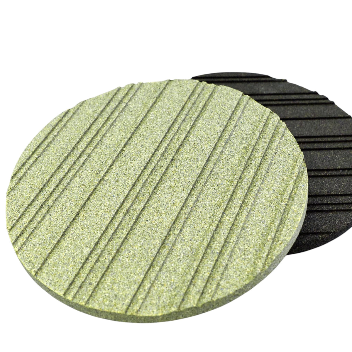Hem And Tassel round cork trivets with grooved heat-dissipating patterns in green and black, made in Portugal.