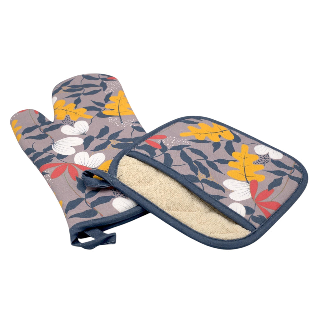Hem And Tassel oven mitt and pot holder set featuring a grey background with colorful oak leaf patterns in cotton