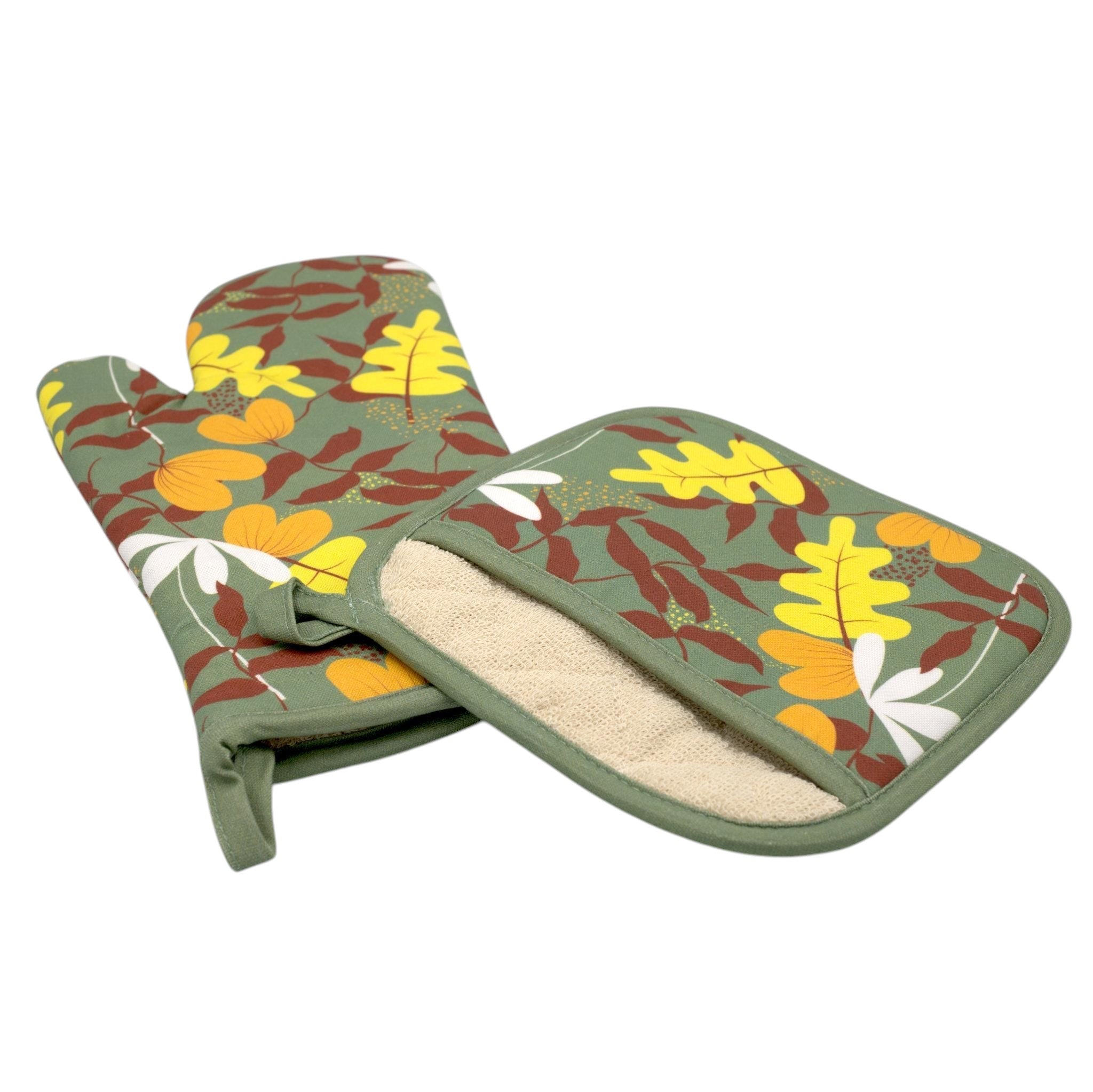 Hem And Tassel cotton oven mitt and pot holder set featuring a green, yellow, and brown oak leaf print pattern