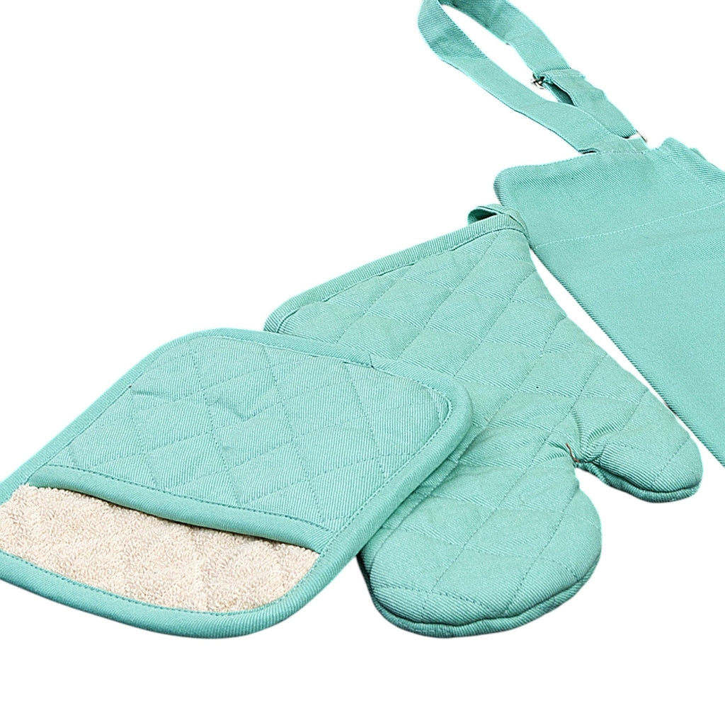 Hem And Tassel mint green quilted cotton drill oven mitt and pot holder set on a dark wooden surface