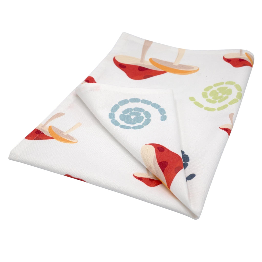 Hem And Tassel cotton kitchen towel with a retro mushroom and swirl print on an optic white background.