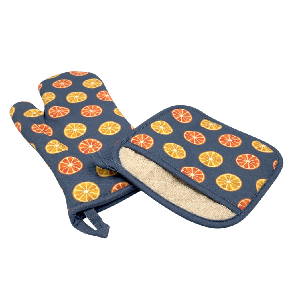 Hem And Tassel orange citrus print cotton oven mitt and quilted pot holder set on a white background