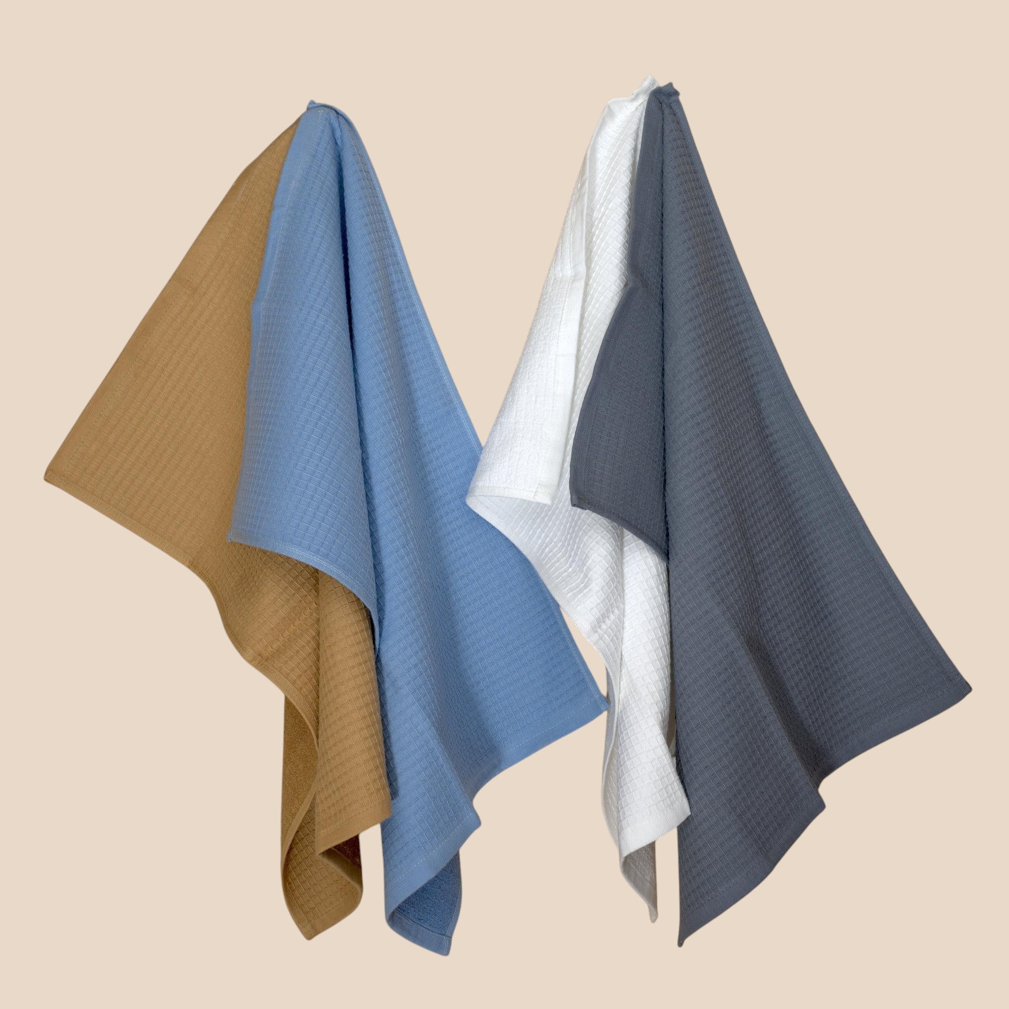 Hem And Tassel Jekyll & Hyde reversible cotton kitchen towels in tan, blue, white, and grey with ribbed waffle texture.