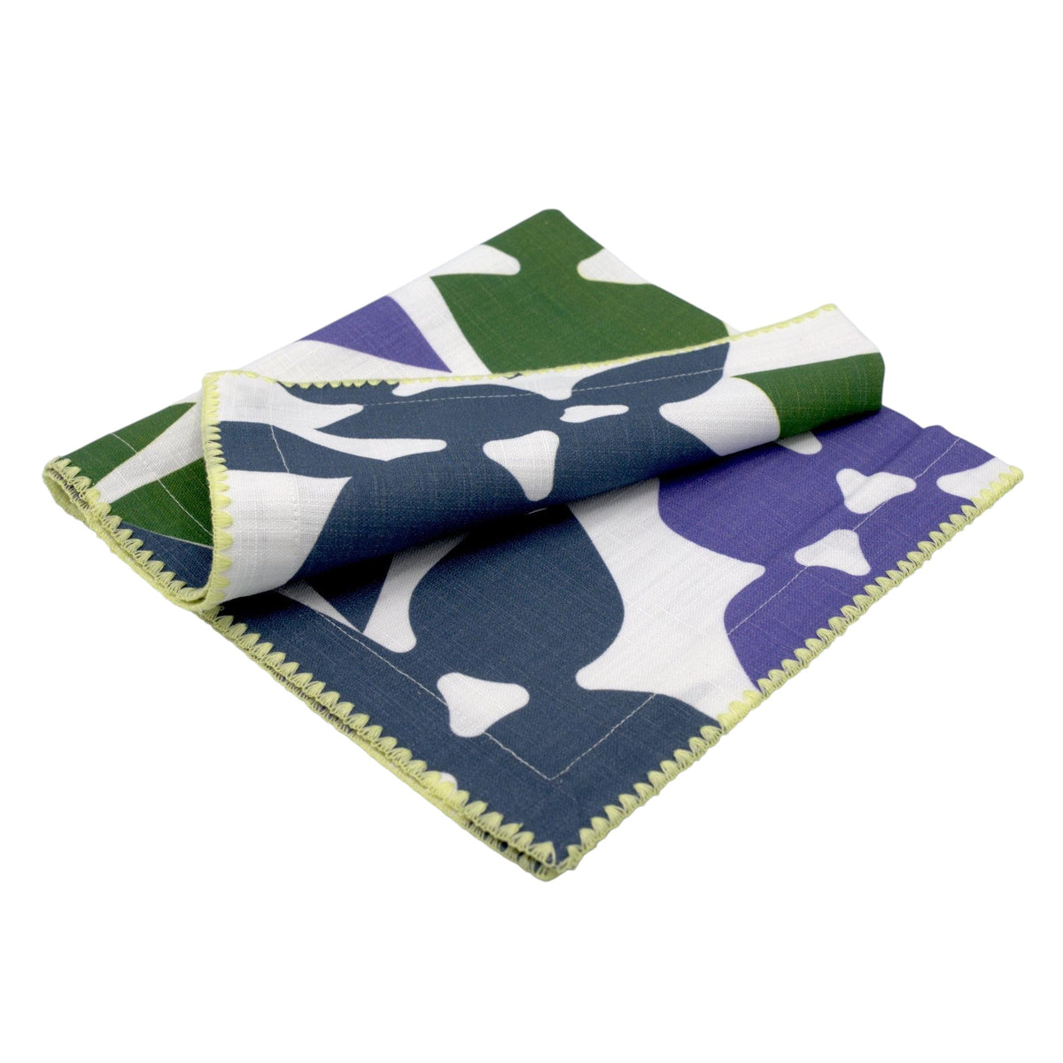 Hem And Tassel Celebration slub cotton dinner napkin with green, purple, and white leaf-inspired confetti pattern